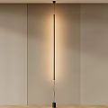 Sleek Modern Wall Light With Warm Glow And Minimalist Design On Beige Wall
