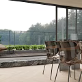 Modern Bright Open Living And Dining Space With Large Floor Glass Windows Overlooking Lush Scenery