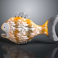 Orange and yellow spotted fish with grey fins tail and sharp teeth