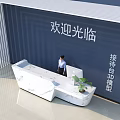 Modern Marble Reception Desk With Computer Welcome Sign And Blue Wall In Lobby