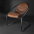 Stylish Leisure Chair With Black Metal Frame Brown Leather Seat And Gray Geometric Blanket