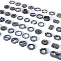 Industrial Equipment Parts Various Black Components Including Gears Washers Bearings And Connectors On White Background