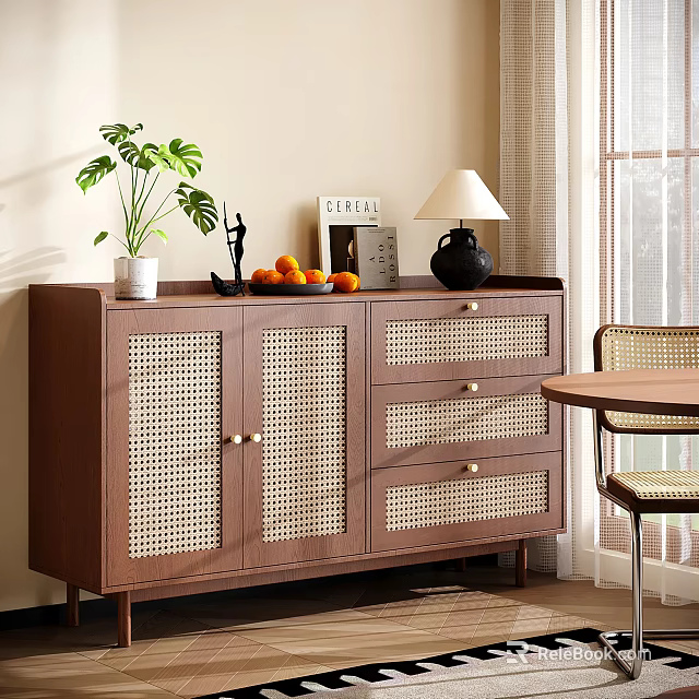 Wooden Sideboard with Rattan Doors Potted Plant Table Lamp Fruit Bowl and Books in Dining Area 3d model 