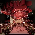 Elegant Banquet Hall With Red Decorations Flower Arrangements Golden Chairs And Butterfly Chandeliers