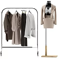Standing Metal Clothes Hanger With Coats Sweaters Pants And Mannequin In Beige Outfit