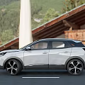 White Peugeot SUV Exterior Design With Black Wheels Parked On Road And Mountain View