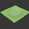 Decorative Cast Iron Manhole Cover On Gray Pavement With Grass Around And Intricate Circular Pattern
