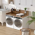 Organized Laundry Room Setup With Dual Washing Machines Wooden Countertop And Green Plants