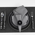 Tech Exhibition Hall Displaying Modern Tableware Set With Patterned Handles And Black Placemat 3d model