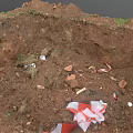 Construction Site Excavation Area With Loose Soil Debris And Scattered Waste Materials
