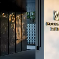 Modern Entrance Gate With Metal Panels Geometric Logo And Shadow Patterns