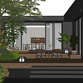 Modern Courtyard Garden with Lush Green Plants Outdoor Seating and Illuminated Steps