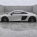 White Audi Two Door Sports Car In Spacious Modern Studio With Reflective Floor