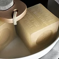 Minimalist Bathroom Accessories with White Tray Soap Black Container and Gray Towel on Wooden Surface
