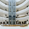 Spacious Modern Shopping Mall Lobby With Multi Level Staircase And Glass Railings
