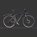 Mountain Bike With Fenders Displayed On Wooden Platform Against Black Background