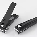 Two Black Metal Nail Clippers With Sharp Blades And Ergonomic Handles