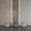 Gray Stone Floor Surrounded By Decorative Stone Spheres And Illuminated Light Strips On Stone Walls