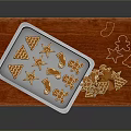 Freshly Baked Gingerbread Cookies on Baking Tray with Wooden Cutting Board and Star Shapes