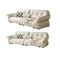 Modern Cream Leather Two Seater Sofa With Black White Patterned And Striped Decorative Pillows