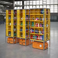 Industrial Storage Equipment Yellow Shelves With Orange Bases In Industrial Facility