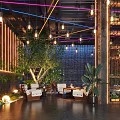 Modern Café Interior Design With Wooden Decor Hanging Lights Green Plants And Comfortable Seating
