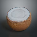 Halved Coconut With White Flesh And Brown Outer Shell On Dark Surface