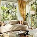 Sunny Living Room With Beige Sofa Decorative Pillows Yellow Curtains Large Windows And Forest View