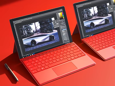 Two Red Digital Laptops with Design Software Interface Displaying Car Image and Pen on Background 3d model