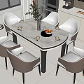 Round Marble Dining Table with Grey Chairs and Decorative Vase Fruit Cups in Modern Kitchen
