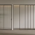 Modern Black Frame Sliding Doors With Ribbed And Clear Glass Panels In Interior Space
