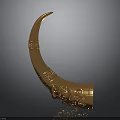 Golden Decorative Horn With Intricate Carved Patterns On Dark Background