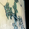 Decorative Stained Glass Window Featuring Blue Green Patterns Cross And Diamond Shapes