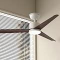 White Ceiling Fan Light With Four Dark Blades Mounted On Ceiling Near Window Blinds