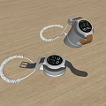 Two Digital Clocks With Retractable White Cable And Silver Case On Light Wooden Surface 3d model