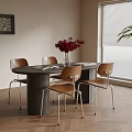 Modern Round Dining Table Set With Four Brown Chairs Metal Legs And Red Flower Vase