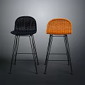 Woven Black and Orange Bar Stools With Black Metal Legs In Dark Background