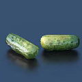 Two Fresh Green Cucumbers With Textured Surface On Dark Background