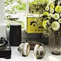 Headphones and Speakers with Vinyl Turntable in Bright Room with Green Plants