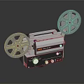 Vintage Projection Monitoring Equipment With Film Reels And Control Knobs On Dark Surface