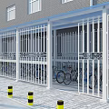 Building Ground Floor Awning For Motorcycle And Bicycle Parking With Safety Bollards And Green Shrubs