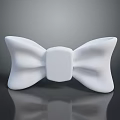 Butterfly Shaped Bow Tie in White Color on Black Reflective Surface with Smooth Texture