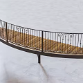 Curved Metal Railing With Ornate Scroll Designs And Wooden Deck Surface