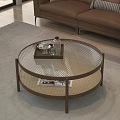 Round Coffee Table with Glass Top Brown Frame Woven Shelf Tray Water Bottle and Magazines