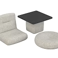 Light Colored Fabric Chair with Square Black Top Table and Round Pouf Set