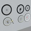 Assorted Bicycle Tires with Black Red White Rims Arranged on White Background