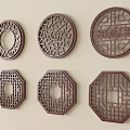 Chinese Traditional Carved Wall Decorations With Circular Octagonal Shapes And Intricate Patterns