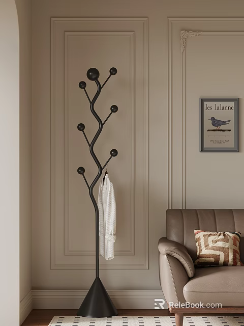 Black Tree Shaped Coat Rack With White Bathrobe Near Brown Sofa And Geometric Pillow 3d model 
