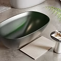 Freestanding Oval Bathtubs in Various Colors with Side Tables and Plants
