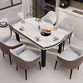 Round Marble Dining Table with Grey Chairs and Decorative Vase Fruit Cups in Modern Kitchen